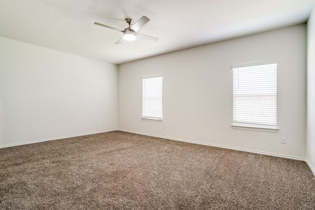 Spare room featuring carpet floors and ceiling fan | Image 7