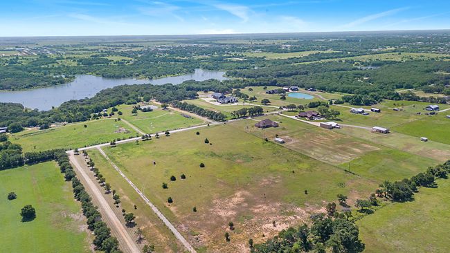 Aerial overview of property's location featuring a nearby body of water and rural landscape | Image 4