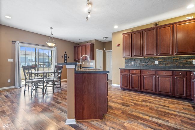 Wonderful kitchen with planning desk, custom cabinetry, new appliances and adjoining breakfast area. | Image 10