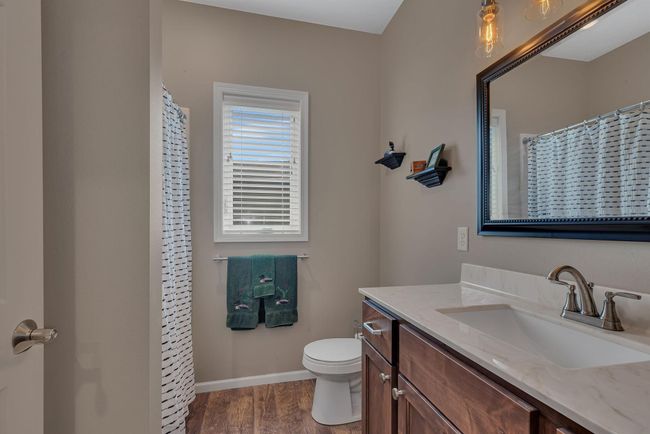 Guest bath on the main level nicely separating the guest and personal spaces | Image 16