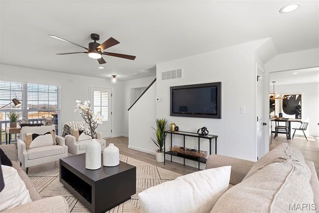 Living room with light wood-style flooring, recessed lighting, ceiling fan, and baseboards | Image 6