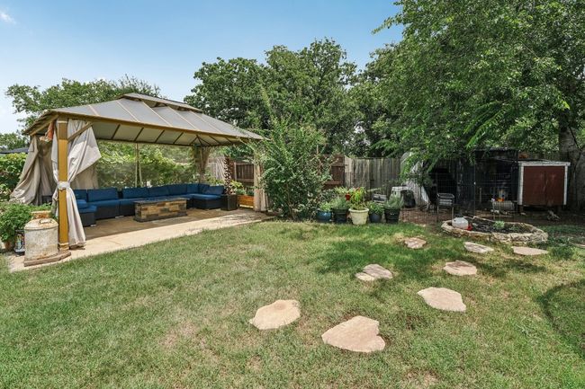 Fenced backyard featuring outdoor lounge area, a gazebo, and a patio area | Image 30