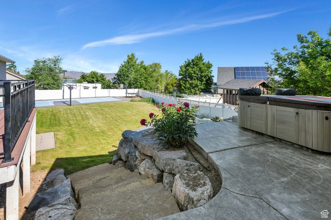 View of yard featuring a hot tub and a patio area | Image 26
