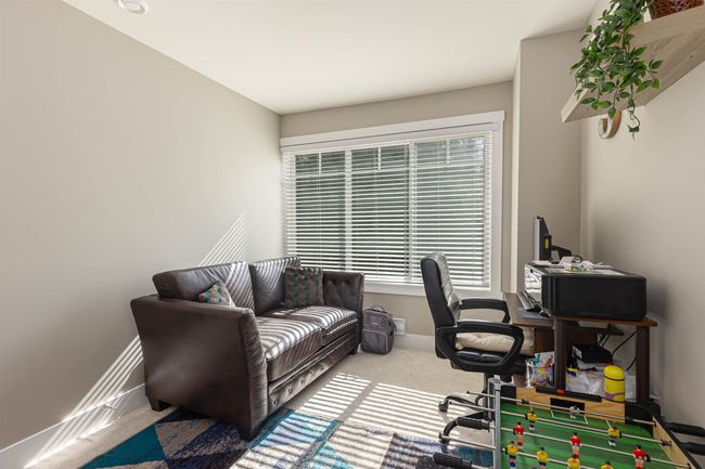 Carpeted office space with plenty of natural light and baseboards | Image 26