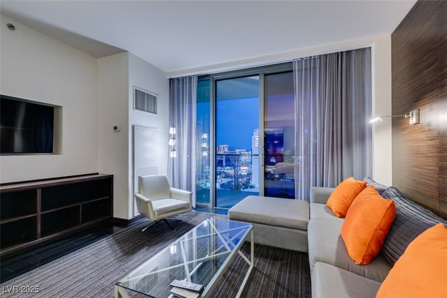 Living area with a wall of windows | Image 13