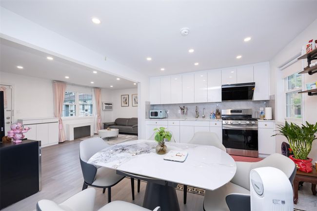 Dining area featuring plenty of natural light, recessed lighting, light wood finished floors, and a fireplace | Image 9