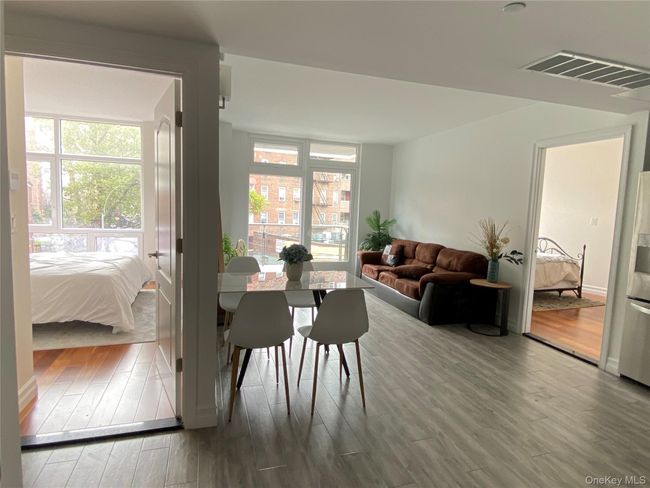 Dining space with wood finished floors | Image 7