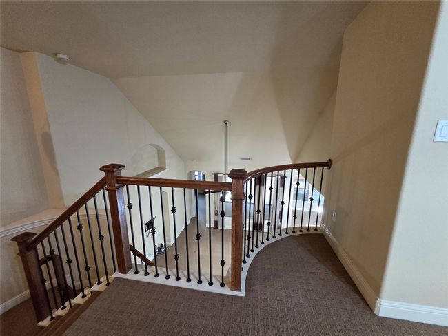 Stairs with carpet floors and vaulted ceiling | Image 32