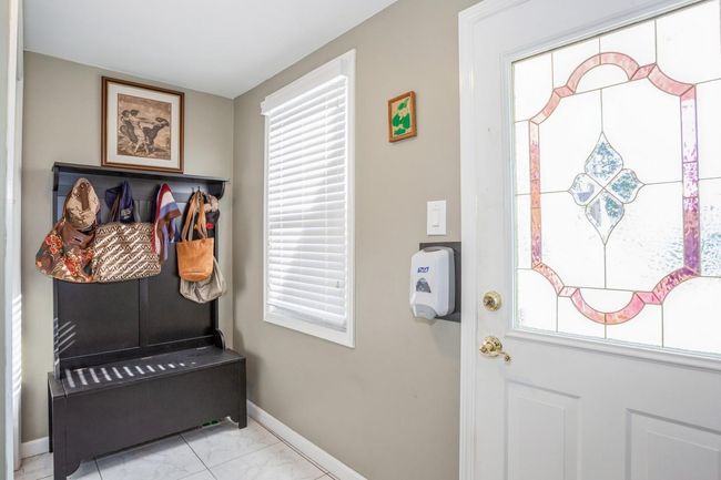 Mudroom with marble finish floor and baseboards | Image 14
