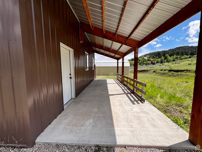 View of patio / terrace with a view of trees | Image 23