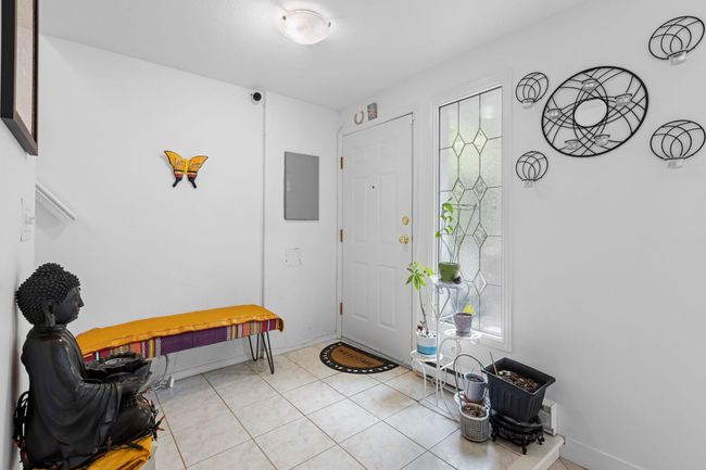 Foyer entrance featuring electric panel and tile patterned flooring | Image 15