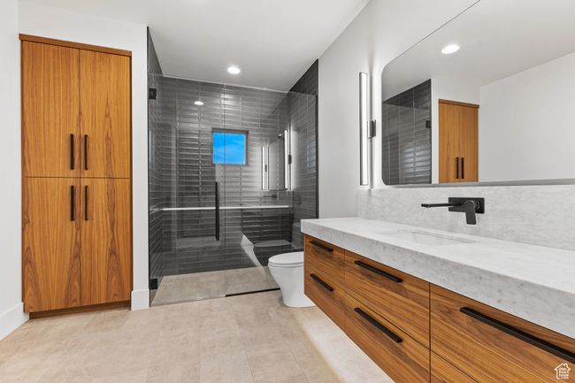 Bathroom with a shower stall, toilet, and recessed lighting | Image 47