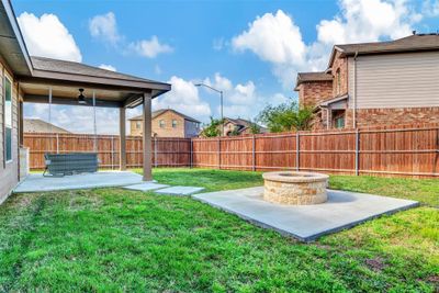 View of yard with a fire pit and a patio | Image 2