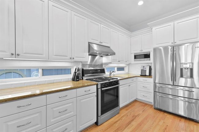 Abundant storage and ample natural light enhance this space. | Image 19