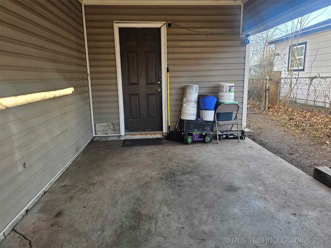 Attached carport, lead to utility room for convenicnes accessiblity | Image 4