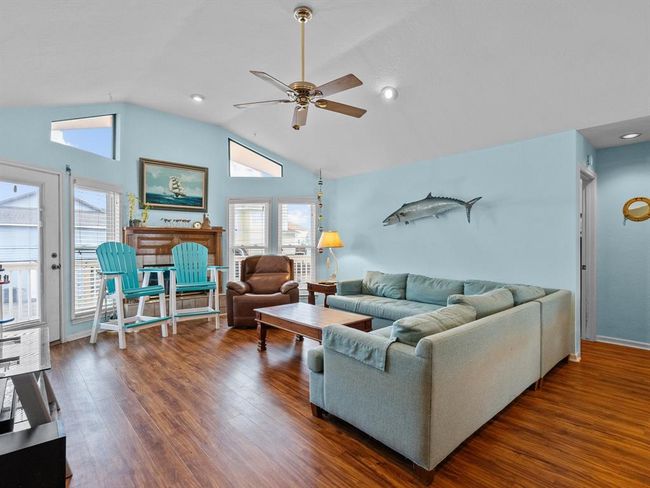 Family Room looks onto the front porch and has plenty of natural light. | Image 6
