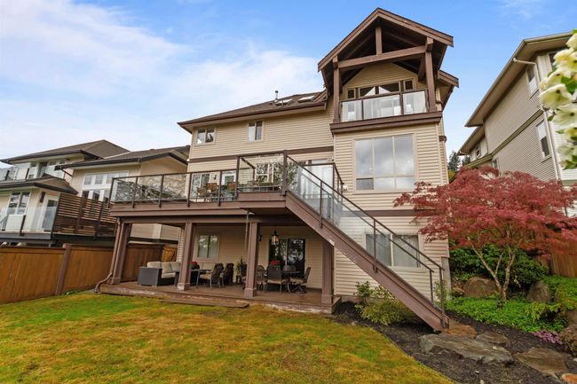 Back of property with outdoor lounge area, fence, a deck, stairs, and a yard | Image 30