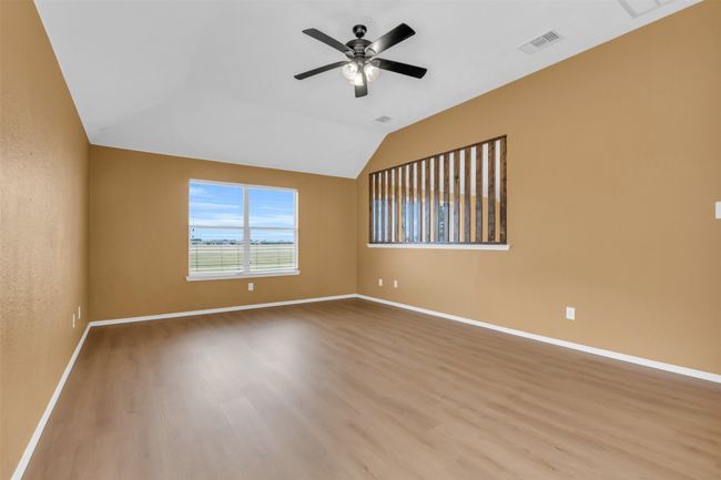 Loft area with wood finished floors. | Image 19