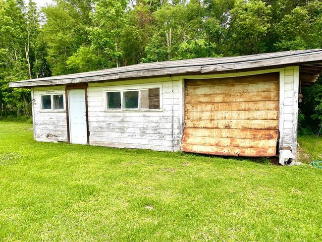 Orr maybe your the fixer upper type.. This could be updated into a little apartment, shop/garage or that man gave you've been wanting. Many possibilities. (this structure is being sold "As Is" | Image 21