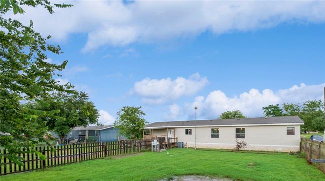 Back of property featuring a fenced backyard | Image 24