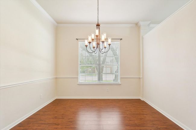 Unfurnished room with a chandelier, wood finished floors, and ornamental​​‌​​​​‌​​‌‌​‌‌​​​‌‌​​‌‌​‌​​​​​‌ molding | Image 7