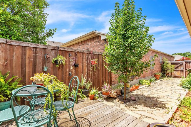 Wooden deck featuring a fenced backyard | Image 16