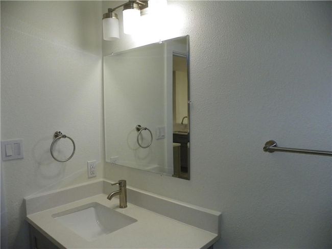 Bathroom featuring vanity | Image 13