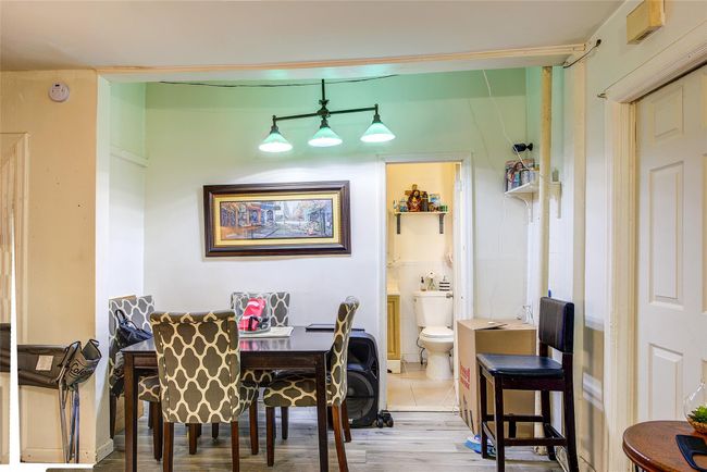 Dining space featuring wood finished floors | Image 21