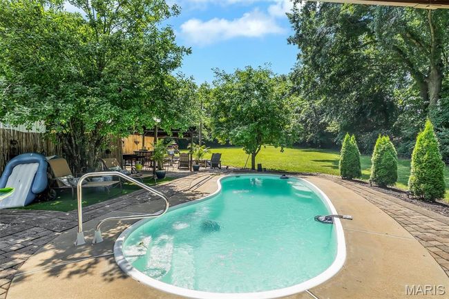 View of pool featuring a patio area | Image 20