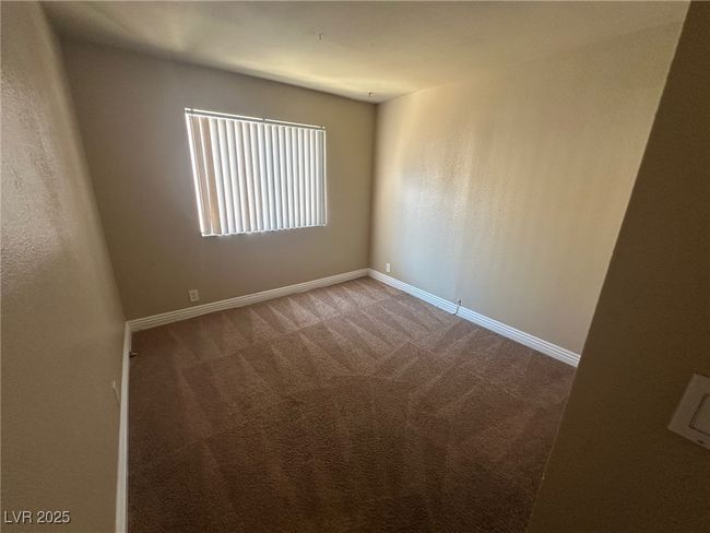 Spare room with baseboards and carpet | Image 13