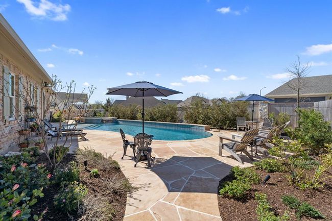 Buckskin Natural Flagstone Coping and Deck. This backyard is amazing! | Image 40