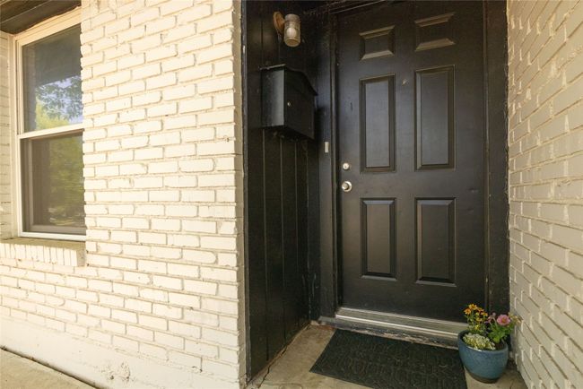 Entrance to property featuring brick siding | Image 4