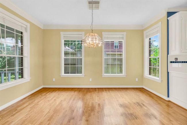 Large breakfast area between kitchen and back porch. | Image 12