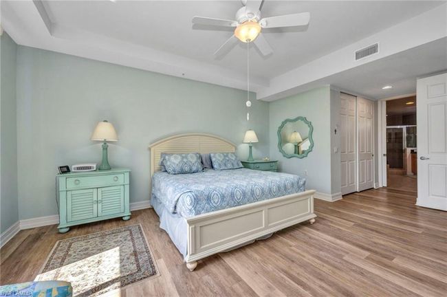Bedroom with wood finished floors, ceiling fan, and recessed lighting | Image 20
