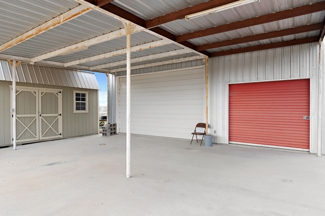 Garage featuring a carport | Image 8