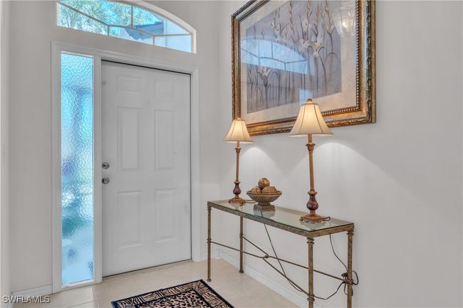Entryway with baseboards and tile patterned flooring | Image 14