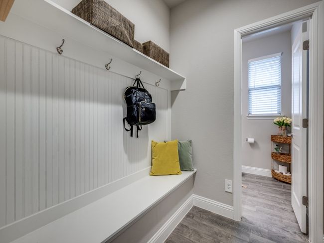 Conveniently located just off the half bathroom, this mudroom offers additional storage and a practical drop zone for daily essentials. | Image 16