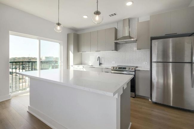 Modern Kitchen with quartz countertops & stainless steel appliances | Image 10