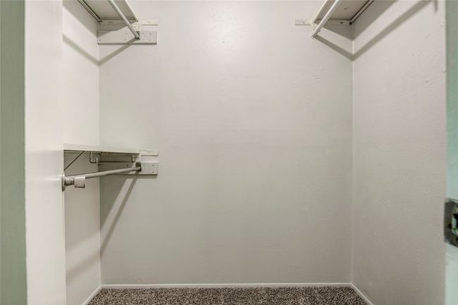 Spacious closet featuring carpet | Image 26