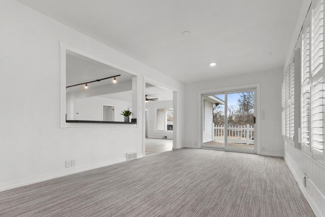Dining Room features a patio door w/ access to the rooftop patios | Image 11