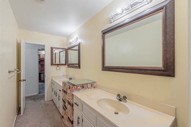 Bathroom featuring vanity | Image 11