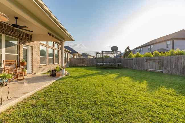 A spacious backyard with endless potential—perfect for creating your dream pool and outdoor retreat. | Image 48