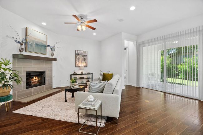 Beautiful hardwood floors carry through the main areas of the home. | Image 10