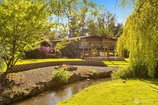 Twin creeks with charming footbridges—watch seasonal salmon migrations from your own backyard. | Image 7