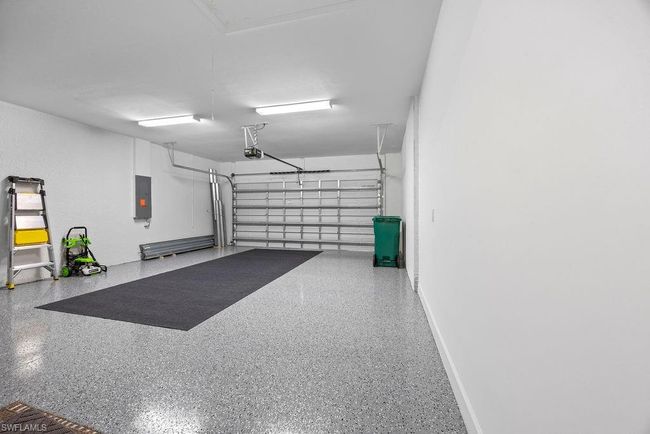 Garage with electric panel and a garage door opener | Image 13