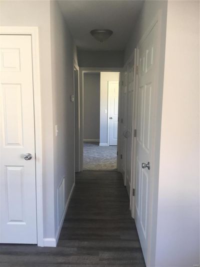 Hallway featuring dark hardwood / wood-style floors | Image 3