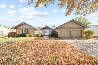 Ranch-style home featuring a 2 car garage | Image 1