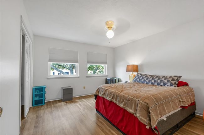 Bedroom featuring wood finished floors and a ceiling fan | Image 13