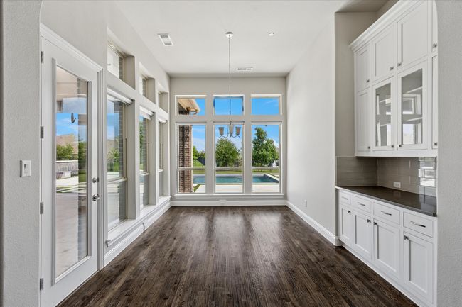 Breakfast room with door to the backyard and views to the in ground pool | Image 16