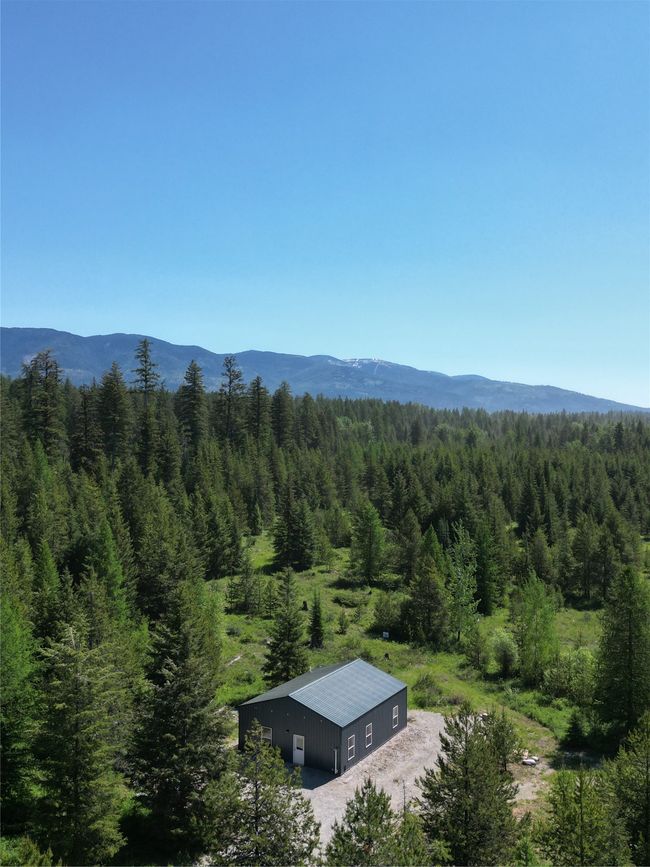 Mountain view featuring a heavily wooded area | Image 27